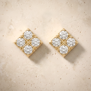 Diamond Square Earrings in 14K solid gold, four-stone squares set on the diagonal, on cream travertine